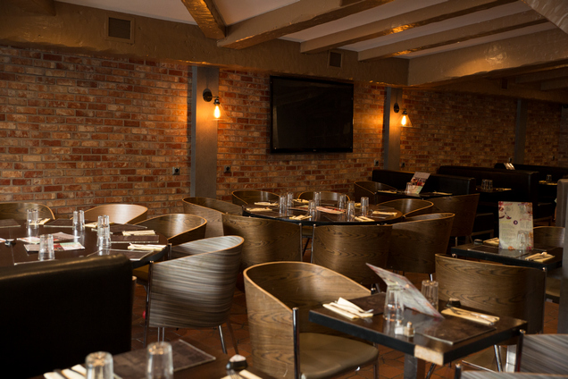 Public restroom refurbishment using wrap finishes